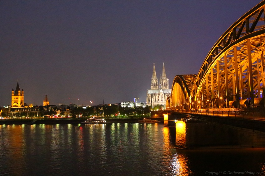 Hohenzollern Bridge and the Cologne Cathedral at night in Cologne, Germany