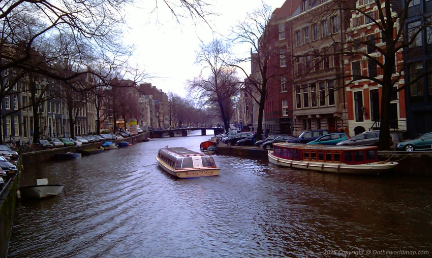 A pleasure boat in a canal in Amsterdam